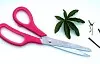 A pair of scissors with a pink handle