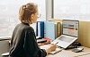 Woman looking at a spreadsheet on her laptop